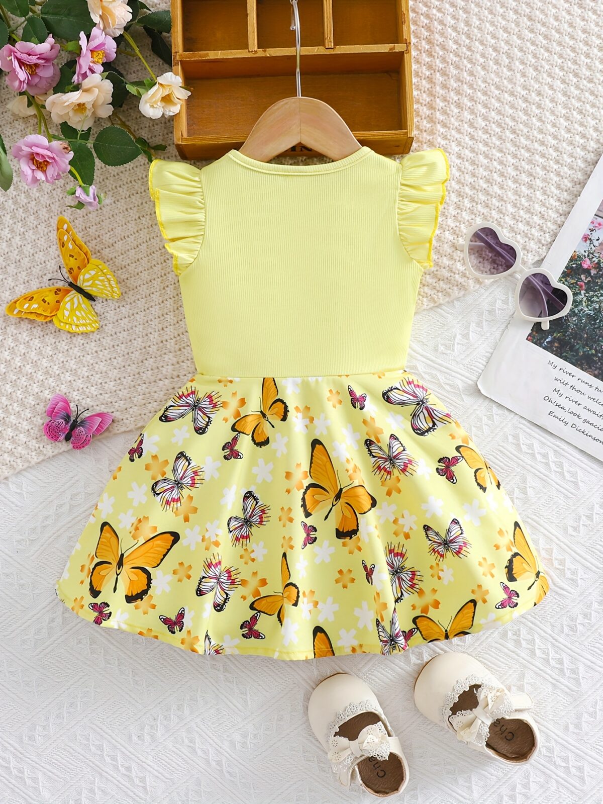 Adorable baby girl in a lavender butterfly dress perfect for summer Newness