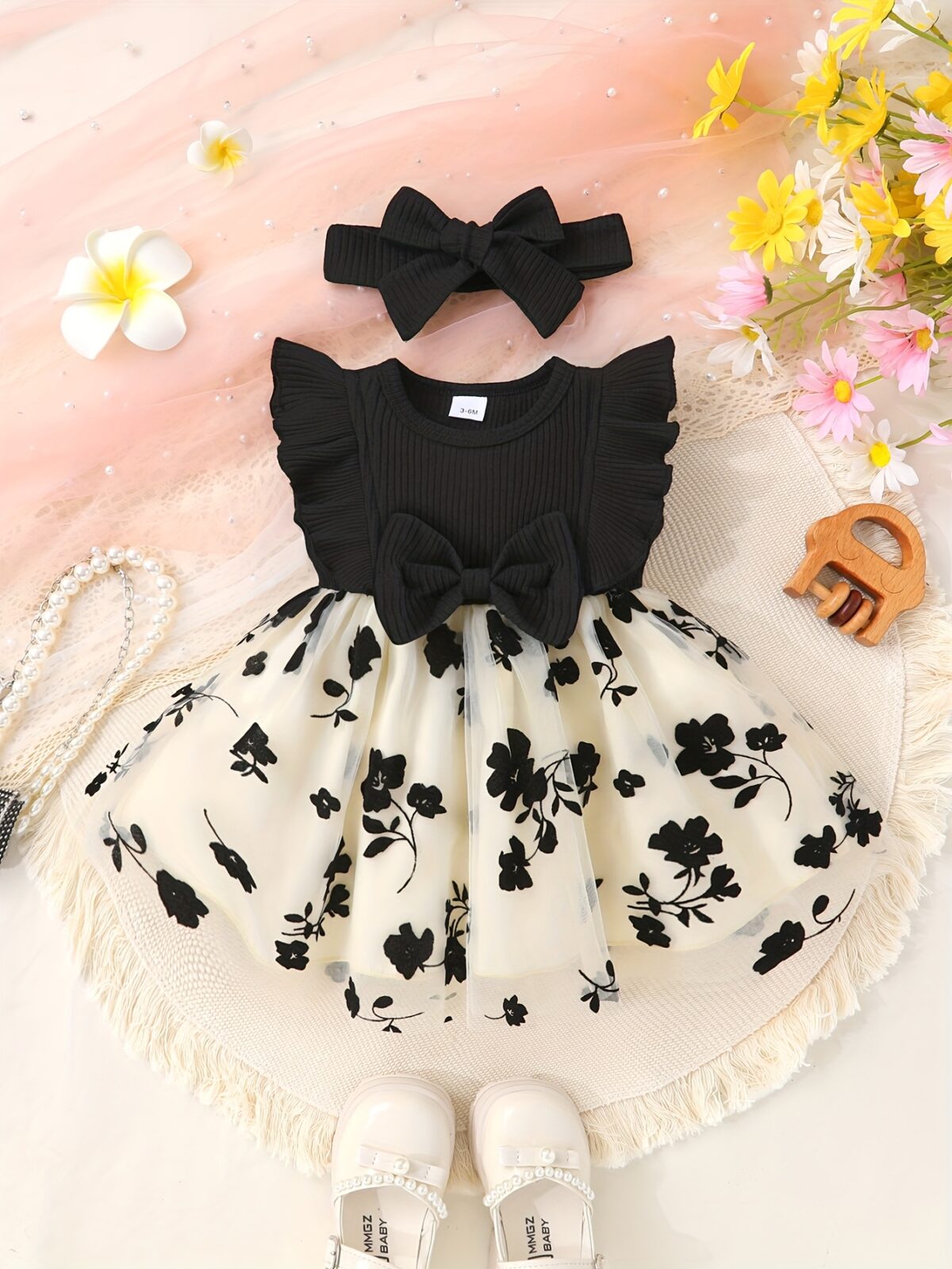 Petite Fleur A charming girl in a floral mesh dress twirling happily