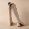 Newnesss Elevated Beige Knee High Boots Elegant beige leather boots that extend to the knee perfect for any occasion
