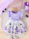 Adorable baby girl wearing a charming butterfly print dress from Newness perfect for spring and summer