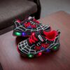Boy wearing stylish Marvel Spider Man LED light up sneakers running and playing The sneakers light up showcasing vibrant colors