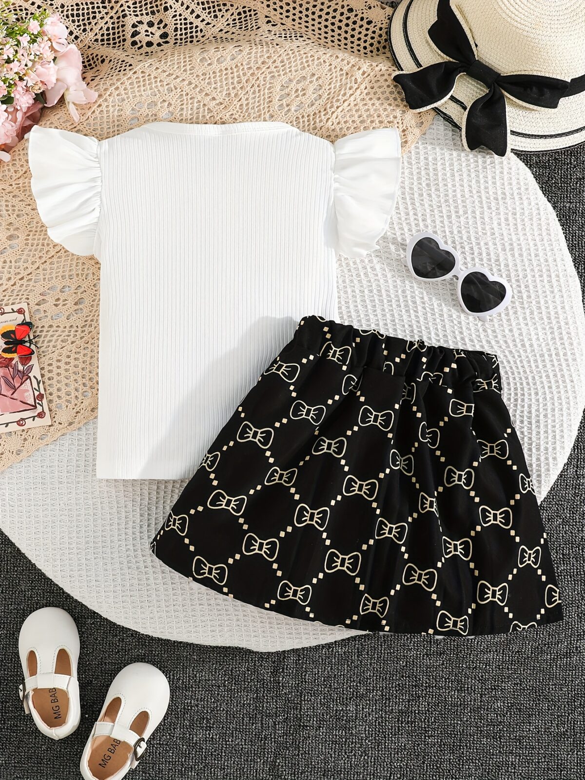 Adorable girls summer outfit Newnesss Summer Playdate Bow Skirt Set A charming two piece set featuring a stylish bow skirt and coordinating top