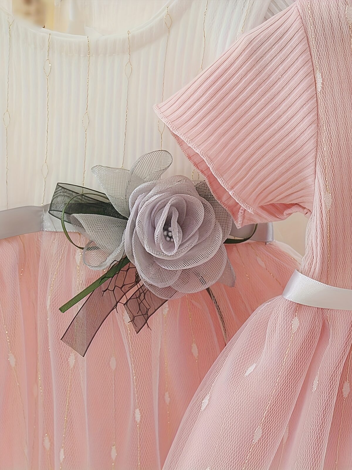 Adorable little girl twirling in a pink Summer Bloom Rose Princess Dress from Newness showcasing its comfortable and stylish design