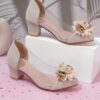 Adorable little girl wearing Newness Enchanted Garden Girls Block Heels showcasing the charming design and comfortable block heel