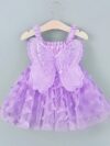Adorable baby girl wearing a Flutterby Mesh Butterfly Dress a perfect summer outfit from Newness