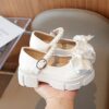 Celestial Bow  Pearl Girls Dress Shoes by Newness Elegant white dress shoes with a delicate bow and pearls perfect for weddings and parties