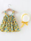 Baby girl wearing adorable Newness floral print dress and hat set perfect for summer