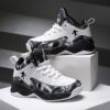Stylish and comfortable Rebellious Splatter Paint Shoes from Newness Durable breathable sneakers with a trendy splatter paint design perfect for young trendsetters