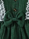 Toddler girl wearing a charming emerald green summer dress ideal for playing outdoors