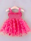Adorable baby girl wearing a Flutterby Mesh Butterfly Dress a perfect summer outfit from Newness