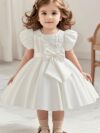 Adorable girl twirling in a lavender colored party dress perfect for birthdays and special occasions The dress features exquisite detailing and a flattering silhouette