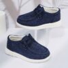 Stylish and comfortable Coastal Breeze boys canvas sneakers in blue perfect for everyday adventures The sneakers feature a classic design with comfortable canvas material