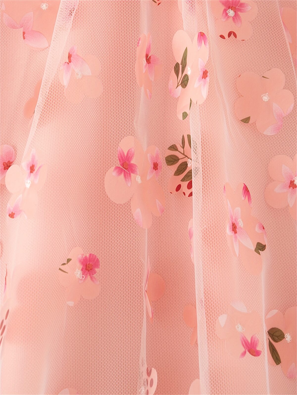 Adorable little girl twirling in a beautiful rosebud garden floral print dress perfect for weddings or a casual day out