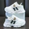 Adorable kids Playful Striped Sneakers with a cute bear charm showcasing Newnesss stylish and comfortable design