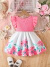 A little girl wearing a charming summer floral print dress