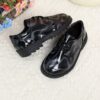 Adorable baby boy wearing stylish and comfortable Newness Little Gentleman shoes