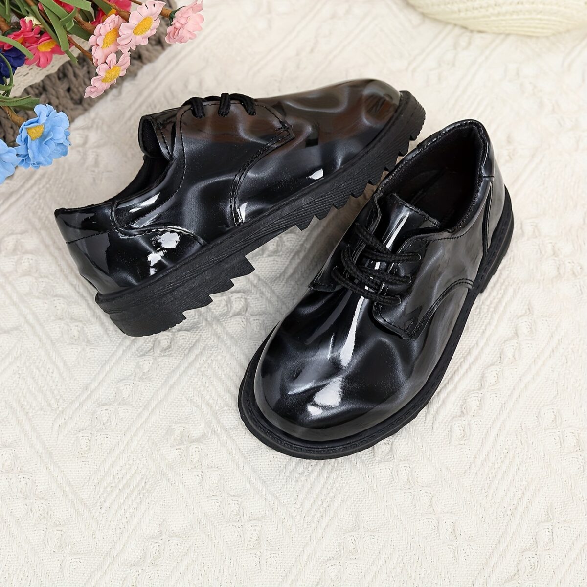 Adorable baby boy wearing stylish and comfortable Newness Little Gentleman shoes