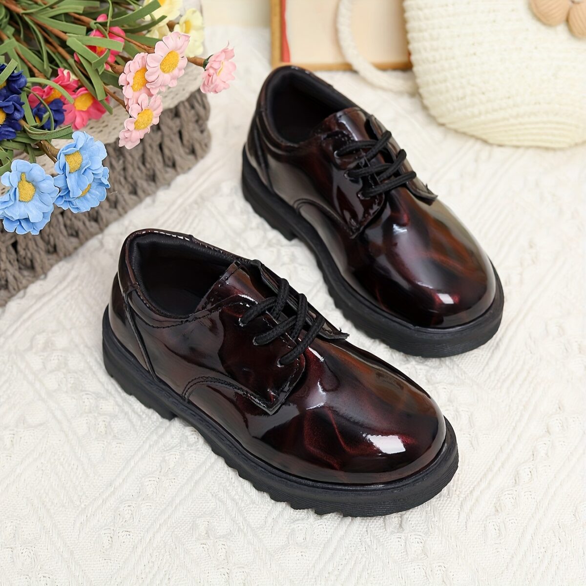 Adorable baby boy wearing stylish and comfortable Newness Little Gentleman shoes