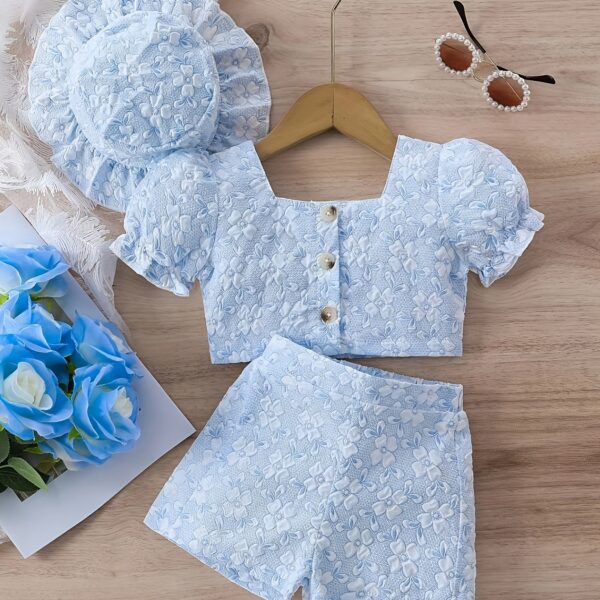 Adorable baby girl wearing a Summer Bloom floral outfit perfect for summer The outfit features a delightful floral pattern