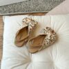 Close up of girls cute flat sandals in pink showing detail and comfort