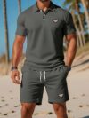 Newness Riviera Escape Mens Navy Polo Set A stylish navy polo shirt and shorts set perfect for summer The model is wearing the set looking relaxed and confident