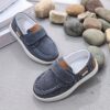 Stylish and comfortable blue canvas shoes for boys perfect for everyday wear The shoes feature a classic design with a touch of modern style