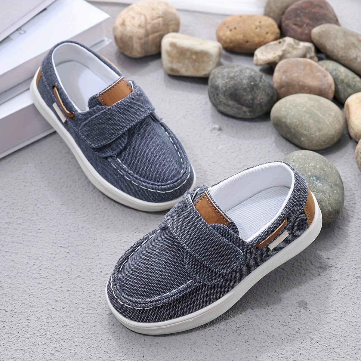 Stylish and comfortable blue canvas shoes for boys perfect for everyday wear The shoes feature a classic design with a touch of modern style