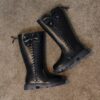 Stylish and warm girls fleece lined bow snow boots perfect for winter adventures The boots are shown from an angle showcasing the fleece lining the bow detail and the durable sole
