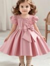 Adorable girl twirling in a lavender colored party dress perfect for birthdays and special occasions The dress features exquisite detailing and a flattering silhouette