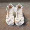 Adorable Princess Bow  Pearl Girls Mary Janes in white perfect for weddings parties and casual wear
