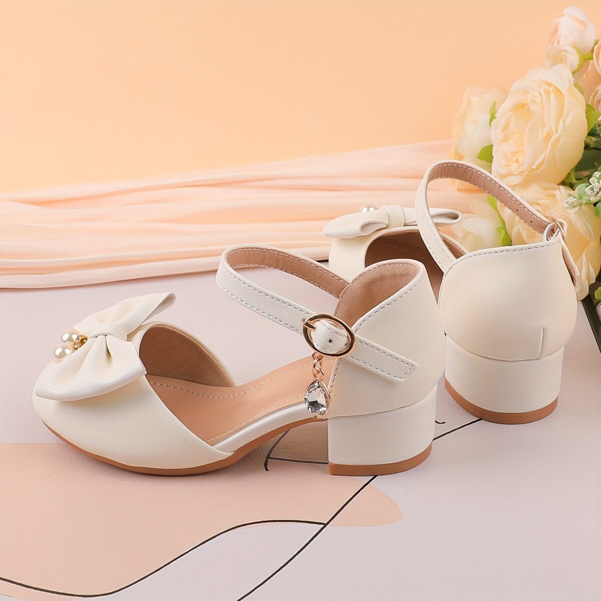 Adorable girls Pearl  Bow Mary Janes in white perfect for weddings parties and special occasions Featuring delicate pearls and charming bows