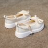 Adorable Princess Bow  Pearl Girls Mary Janes in white perfect for weddings parties and casual wear