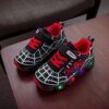 Boy wearing stylish Marvel Spider Man LED light up sneakers running and playing The sneakers light up showcasing vibrant colors