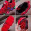 Boy wearing stylish Marvel Spider Man LED light up sneakers running and playing The sneakers light up showcasing vibrant colors