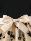 Adorable little girl twirling in a beautiful summer floral mesh dress from Newness The dress is lightweight and perfect for warm weather