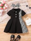 Adorable baby girl in a stylish and comfortable summer dress from Newness perfect for a playdate