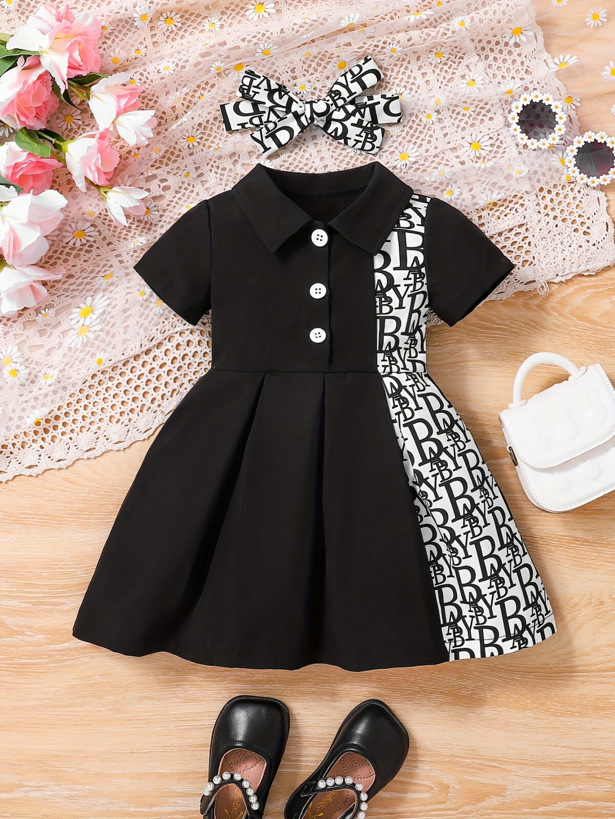 Adorable baby girl in a stylish and comfortable summer dress from Newness perfect for a playdate