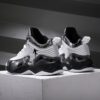 Stylish and comfortable Rebellious Splatter Paint Shoes from Newness Durable breathable sneakers with a trendy splatter paint design perfect for young trendsetters