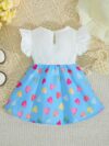 Adorable baby girl wearing a summer heart print dress perfect for school and special occasions