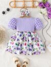 Adorable baby girl wearing a charming Seraphina floral print dress perfect for summer