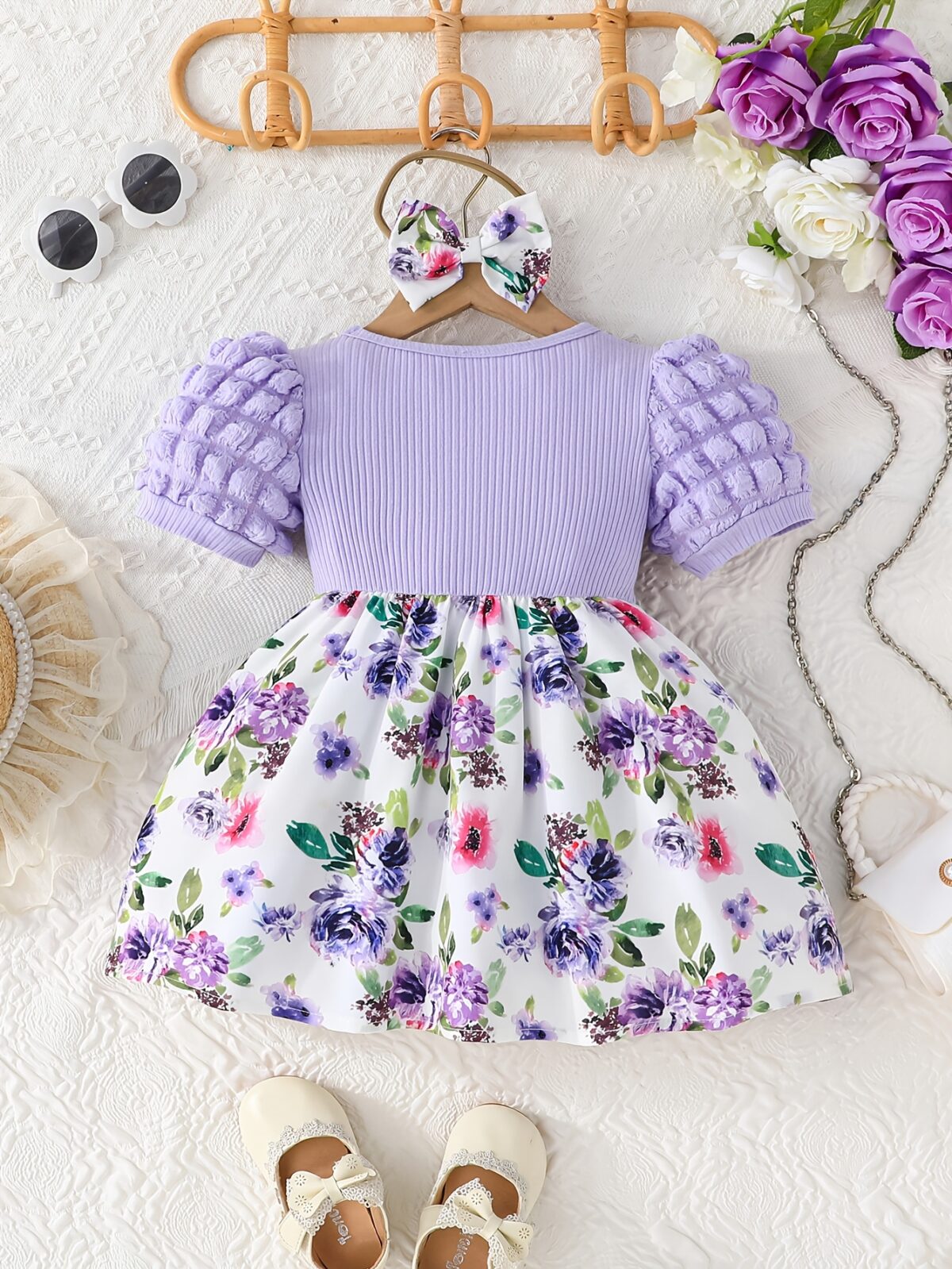 Adorable baby girl wearing a charming Seraphina floral print dress perfect for summer