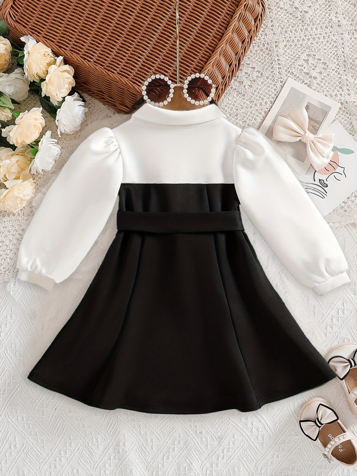 Adorable baby girl wearing a Petite Darling Color Block Dress perfect for birthdays or back to school photos The dress features a vibrant color block design