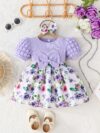 Adorable baby girl wearing a charming Seraphina floral print dress perfect for summer