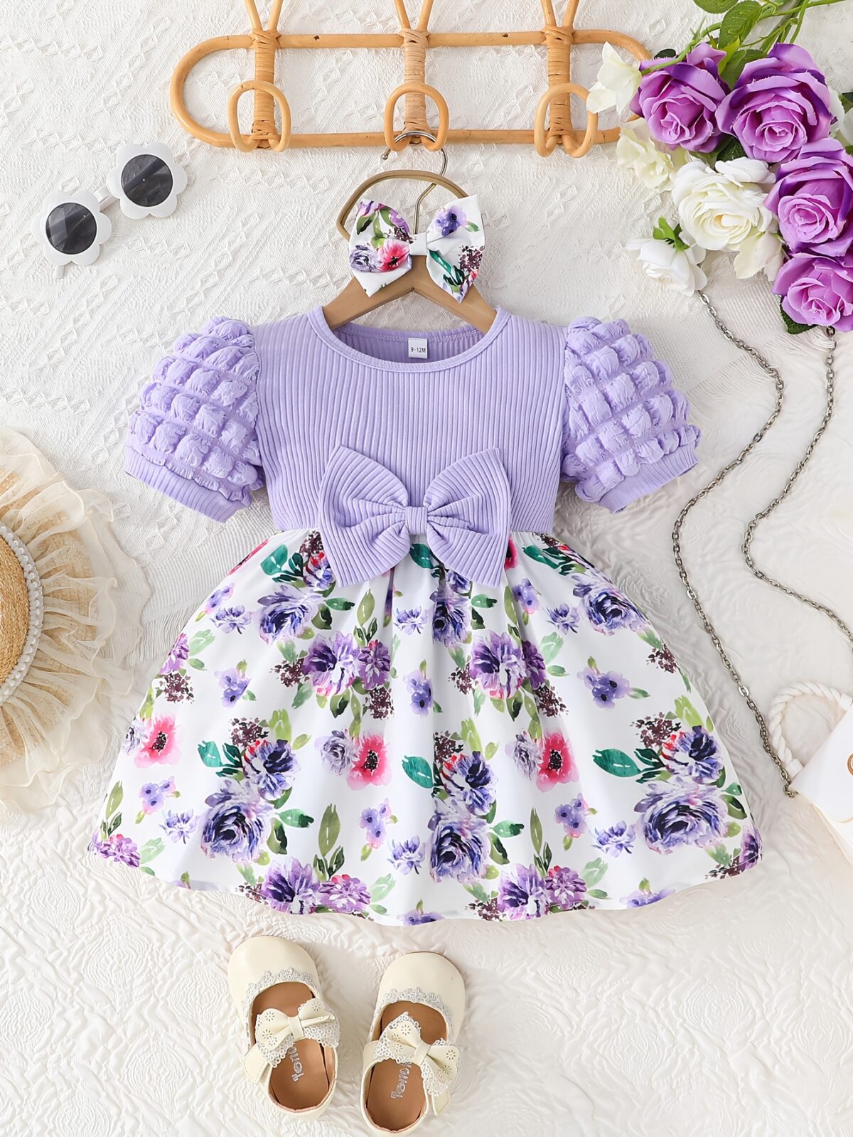 Adorable baby girl wearing a charming Seraphina floral print dress perfect for summer