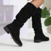 Newness Slouchy Suede Mid Calf Boots in rich brown suede leather showcasing the comfortable slouchy fit and mid calf height Perfect for adding a touch of effortless chic to any winter outfit