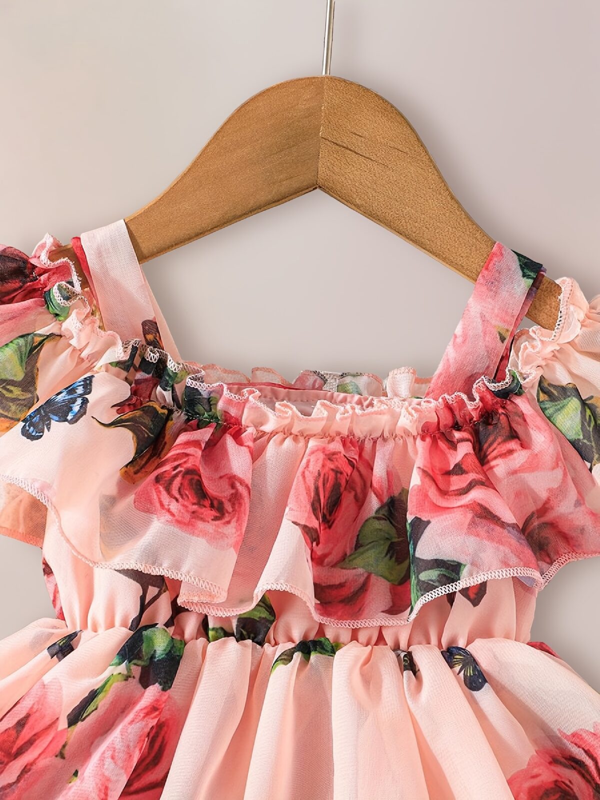 Adorable little girl twirling in a beautiful rose garden floral print dress Perfect summer outfit for kids