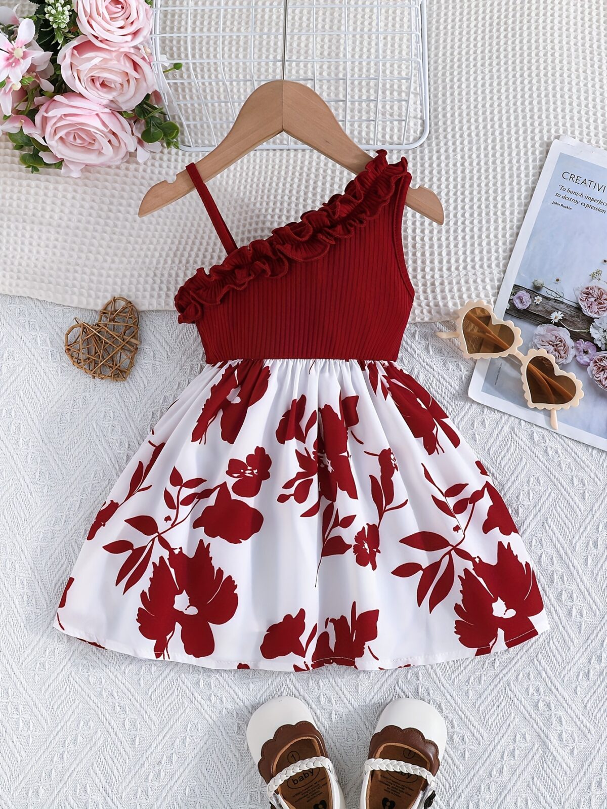 Adorable girl wearing a vibrant Summer Bloom floral print dress perfect for summer vacations