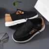 Stylish and comfortable blue canvas sneakers for boys perfect for playtime The shoes feature a classic design with durable construction
