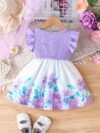 A little girl wearing a charming summer floral print dress