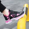 Newness Starlight Glow Running Shoes Trendy black and pink luminous running shoes showcasing comfort and style